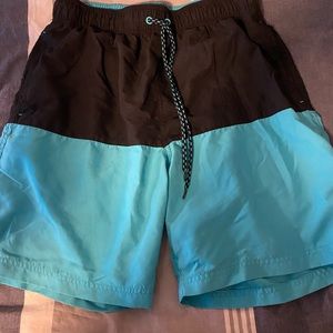George blue and black swim trunks